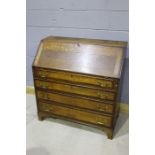 19th Century oak and mahogany bureau, the fall opening to reveal a fitted interior, above four