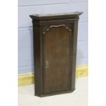 George III oak hanging corner cabinet, 53cm wide