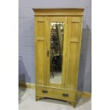 20th Century Art Nouveau style pine wardrobe, the cornice moulded cornice above the mirrored door,