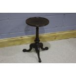 Early 20th Century occasional table, the circular top above a carved column, raised on three