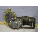 Three 20th Century mirrors, one in an Art Nouveau style oak frame, 72cm wide (3)