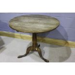 George III oak occasional table, circular top above the turned column, 89cm wide