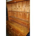 Victorian style pine dresser, the plate rack with two shelves, the dresser base with three drawers