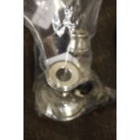 Silver, to include two squat candlesticks with loaded bases, scent bottle with clear glass body