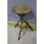 Bamboo occasional table, with a circular top above a cross frame base