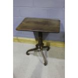 Early 20th Century occasional table, the rectangular top above a turned column, on three cabriole