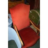 20th Century mahogany armchair, upholstered in red, on turned legs, united by an "X" stretcher, 60cm