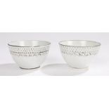 Pair of early 19th Century porcelain tea bowls, in white glaze with black edge decoration and a