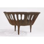 Cast iron fire basket, raised on three tapering supports, 37cm diameter