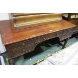 Late Victorian mahogany desk, the rectangular top above five frieze drawers, raised on turned