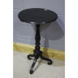 Victorian ebonised tilt top table, the a circular top above the turned column, 49cm diameter