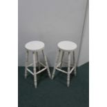 Pair of 20th Century white painted stools, on turned legs, united by stretchers (2)