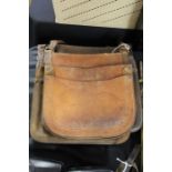 Four brown leather satchels, each with shoulder strap and two compartments (4)