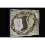 Turkish 900 silver wedding mirror, with embossed foliate decorated back, 11cm wide