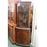 Mahogany standing corner cupboard, the astragal glazed top section above a bow front cupboard