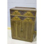 Art Deco style cupboard, the rectangular top above two drawers decorated with roses, above two
