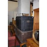 Early 20th Century metal trunks, together with an occasional table and Lloyd Loom style storage unit