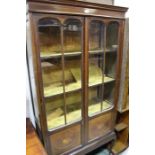 Victorian display cabinet, the frieze pediment above two glazed doors, with marquetry inlay, opening