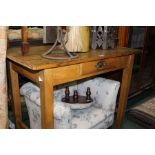 Victorian pine table, with a rectangular top above a frieze drawer and square section tapering legs,