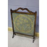 19th Century mahogany framed embroidered firescreen, with foliate scroll and leaves decoration, in