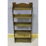 20th Century oak bookshelves, the arched top above five shelves, 112cm high and 45.5cm wide