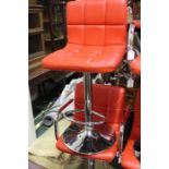 Pair of red leather adjustable bar stools (2)