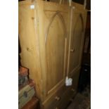 20th Century pine cupboard, the two panelled doors opening to reveal two shelves, above three