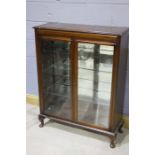 20th Century mahogany display cabinet, the glazed doors opening to reveal three glass shelves, 91.