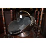 Copper coal scuttle with a shovel