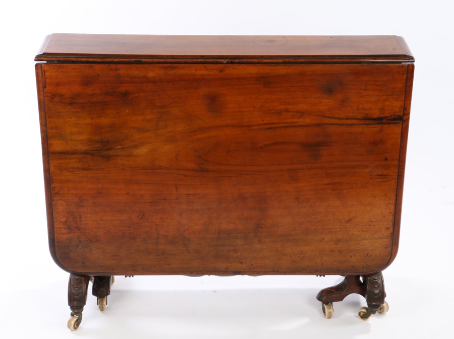 Victorian walnut drop leaf table, with long drop leaves on turned supports and arched feet on