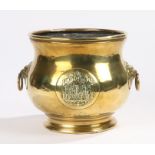 19th Century brass jardiniere, with lion mask handles and central panel with figural decoration,