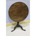 George III mahogany occasional table, with a circular top above a turned and reeded column above