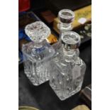 Three glass decanters and stoppers (3)