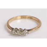 18 carat gold and diamond ring, the head with three platinum set diamonds, ring size J1/2, 1.5g