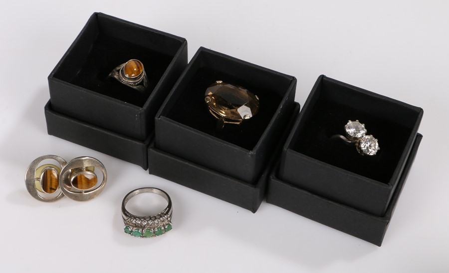 Cubic zirconia set crossover style ring, tigers eye ring and pair of earrings, citrine style ring,