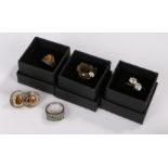 Cubic zirconia set crossover style ring, tigers eye ring and pair of earrings, citrine style ring,