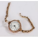 Ladies 9 carat gold wristwatch, the white dial with Arabic numerals, manual wound, on a 9 carat