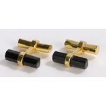 Pair of black onyx and silver gilt set cufflinks, with chamfered and hexagonal ends