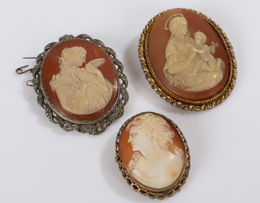 Three cameo brooches to include brooch depicting the Virgin Mary and child, brooch depicting a