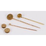 Three gold coloured metal stick pins, two gold coloured metal dress buttons, 6.9g