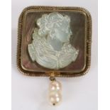 Shell cameo brooch with two hanging pearls to the lower section