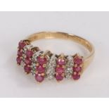 9 carat gold ring set with diamonds and garnets, ring size K. 2.1g