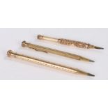 3 Gold plated pencils, to include example with scrolled decoration, (3)