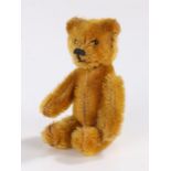 Schuco bear perfume bottle, having a mohair body with moveable arms and legs, the glass bottle to