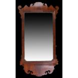 George III walnut mirror, with a rectangular mirror and fret surround, 86cm x 45cm