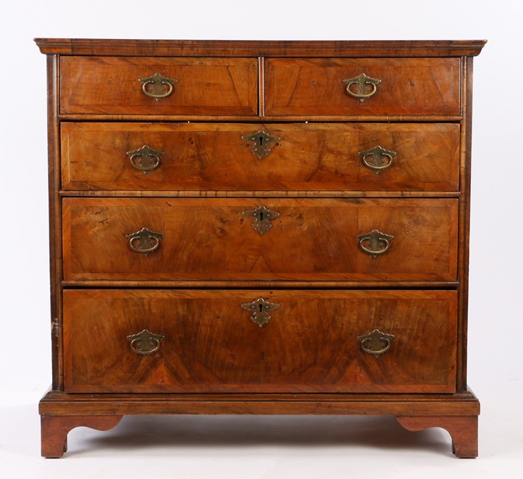 George II walnut chest of drawers, the rectangular top above two short and three long graduated