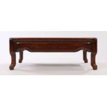 Chinese hardwood Kang table, the rectangular top above a deep shaped frieze above curved legs,