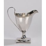 George III silver cream jug, London 1794, makers mark SG, of helmet form with reeded loop handle and