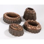 Four 19th Century copper and tin jelly moulds, to include a tall example, an example with a shell to