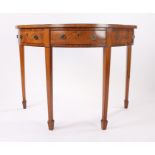 Regency mahogany and crossbanded bow front writing/side table, the bow front top above a central